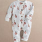 White long-sleeve fruit-print romper with front snap placket