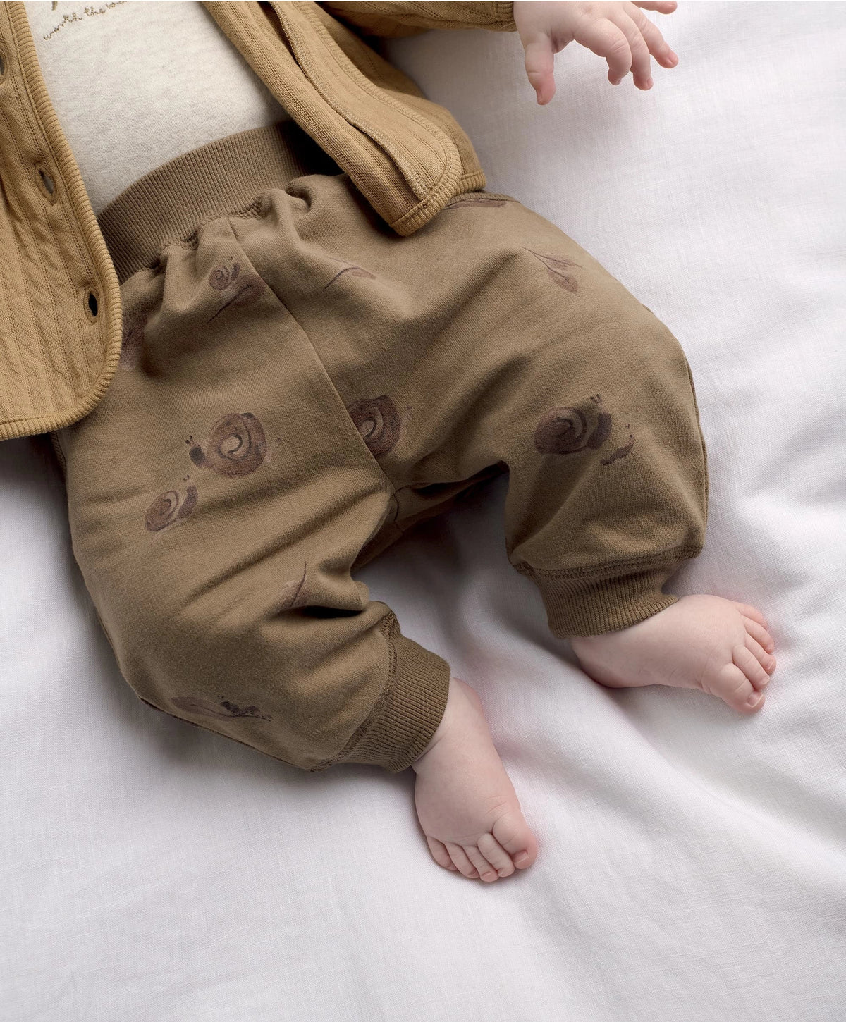 Tan quilted jacket and joggers set with snail face prints