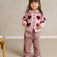 Pink heart cardigan with dark red button front and ribbed cuffs, full outfit view
