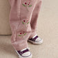 Berry cord trousers with embroidered berry stems, elastic hem cuffs, worn with sneakers