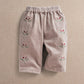Berry cord trousers with allover floral print, elastic waist and relaxed straight legs