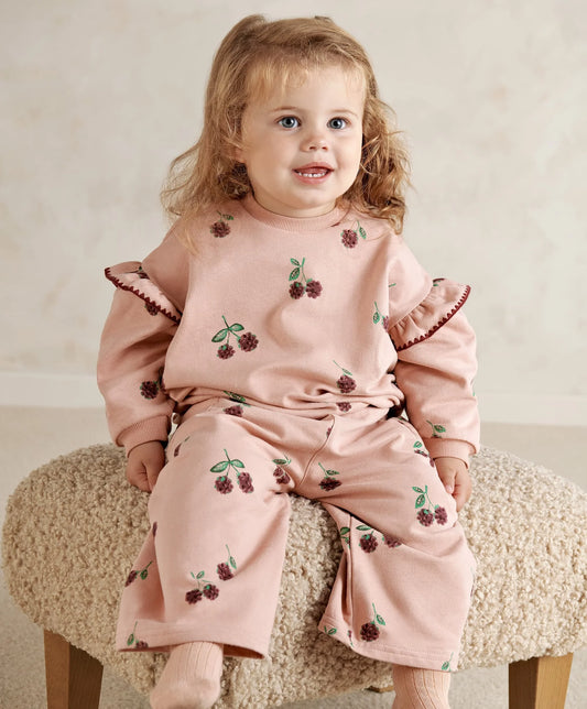Bramble sweatshirt in light pink with berry print and ruffled cuffs