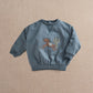 Blue pony sweatshirt with long sleeves and stitched pony graphic