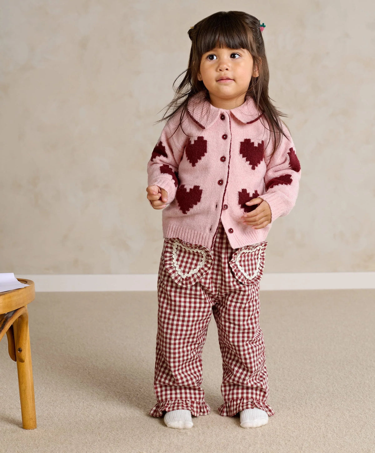 Red gingham trousers with elastic waist, ruffled cuffs and heart-shaped pocket appliques