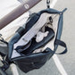 Black changing backpack with zip-open top, adjustable straps, and visible interior