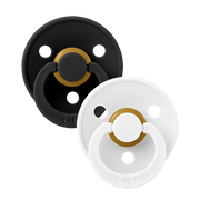 Two latex pacifiers, black and white shields with gold ring, size 2 (6–18 m)
