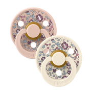 Pair of blush floral latex baby pacifiers with round shields and shield loops