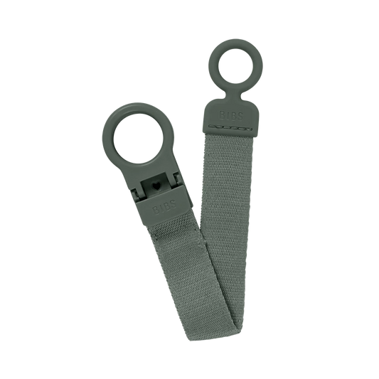 Sage green pacifier clip with two loop rings and BIBS logo tag