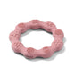 Pink silicone teether ring with textured bumps and swirls for babies