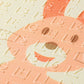 Embossed letters and numbers on foam play mat, pastel peach and cream.
