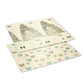 Foam play mat with animal maze and mountain scene, pale cream with sage green accents.
