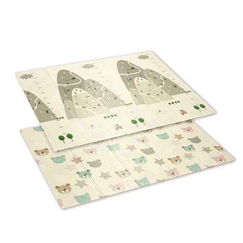 Foam play mat with animal maze and mountain scene, pale cream with sage green accents.