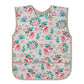 Sleeveless kids apron with pink, teal forest animal print and beige trim; front bib