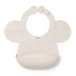 Beige silicone baby bib with adjustable lock and rounded neck opening