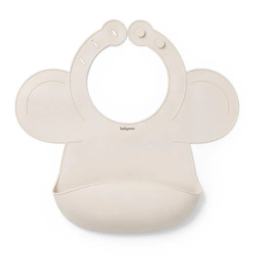 Beige silicone baby bib with adjustable lock and rounded neck opening