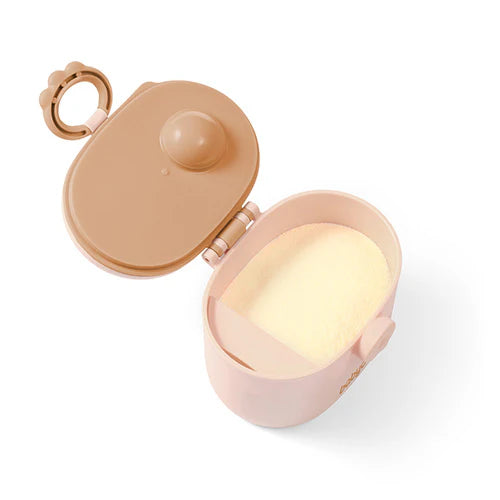 Beige portable milk powder dispenser with open top showing powder compartment and latch