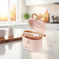 Beige portable milk powder dispenser with open lid and scoop resting inside