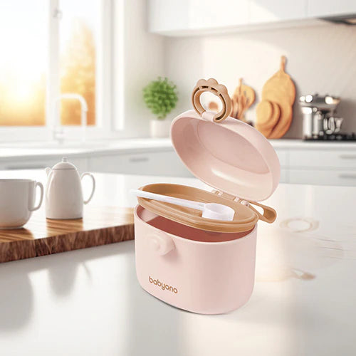 Beige portable milk powder dispenser with open lid and scoop resting inside