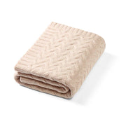 Merino wool blanket, light beige cable-knit fold