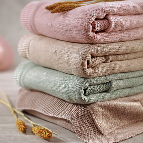 Cotton blanket set with flannel lining: pink, beige, and sage folded stack