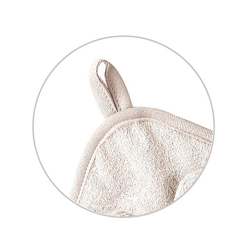 Beige bamboo hooded towel close-up of mouse-ear hood and textured fabric