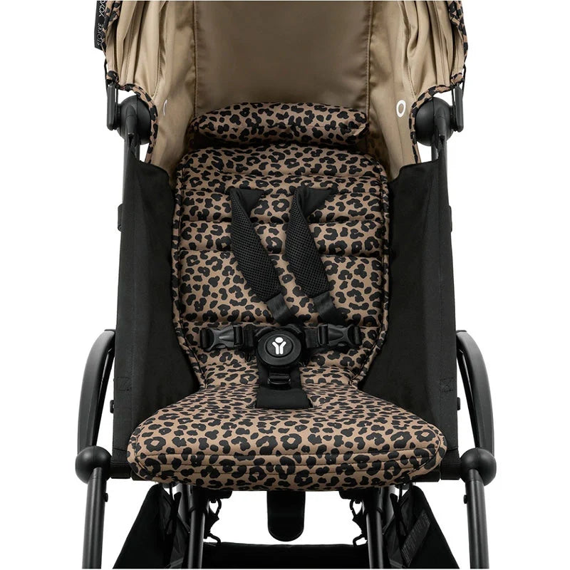 Leopard stroller seat liner with harness openings and patterned foot cover