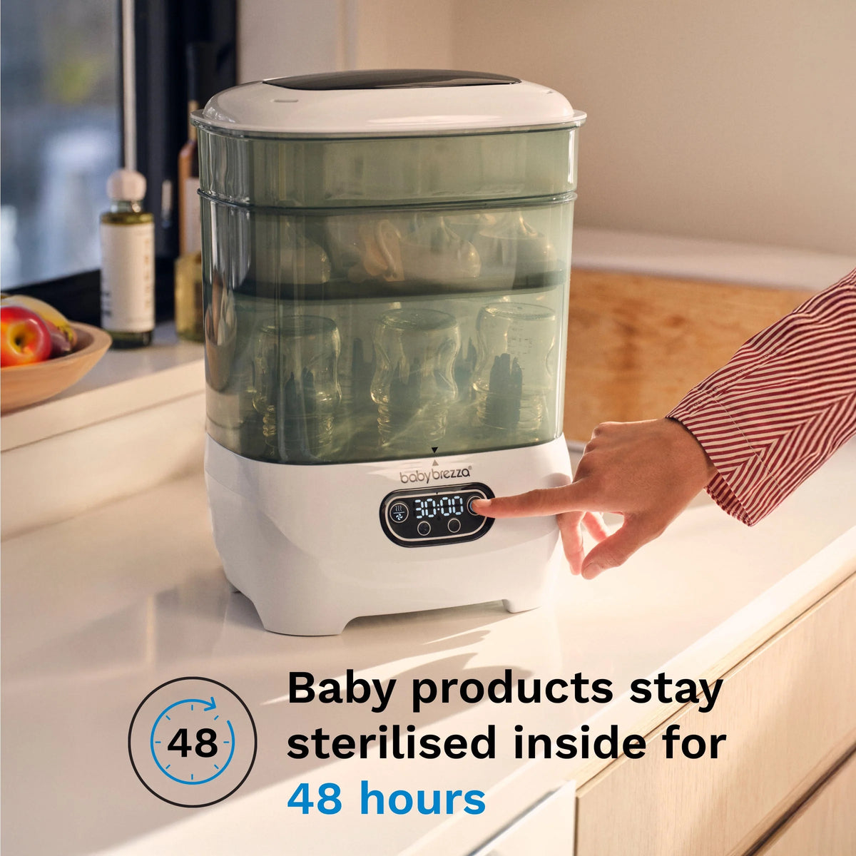 Countertop baby sterilizer dryer with green-tinted lid and digital control panel