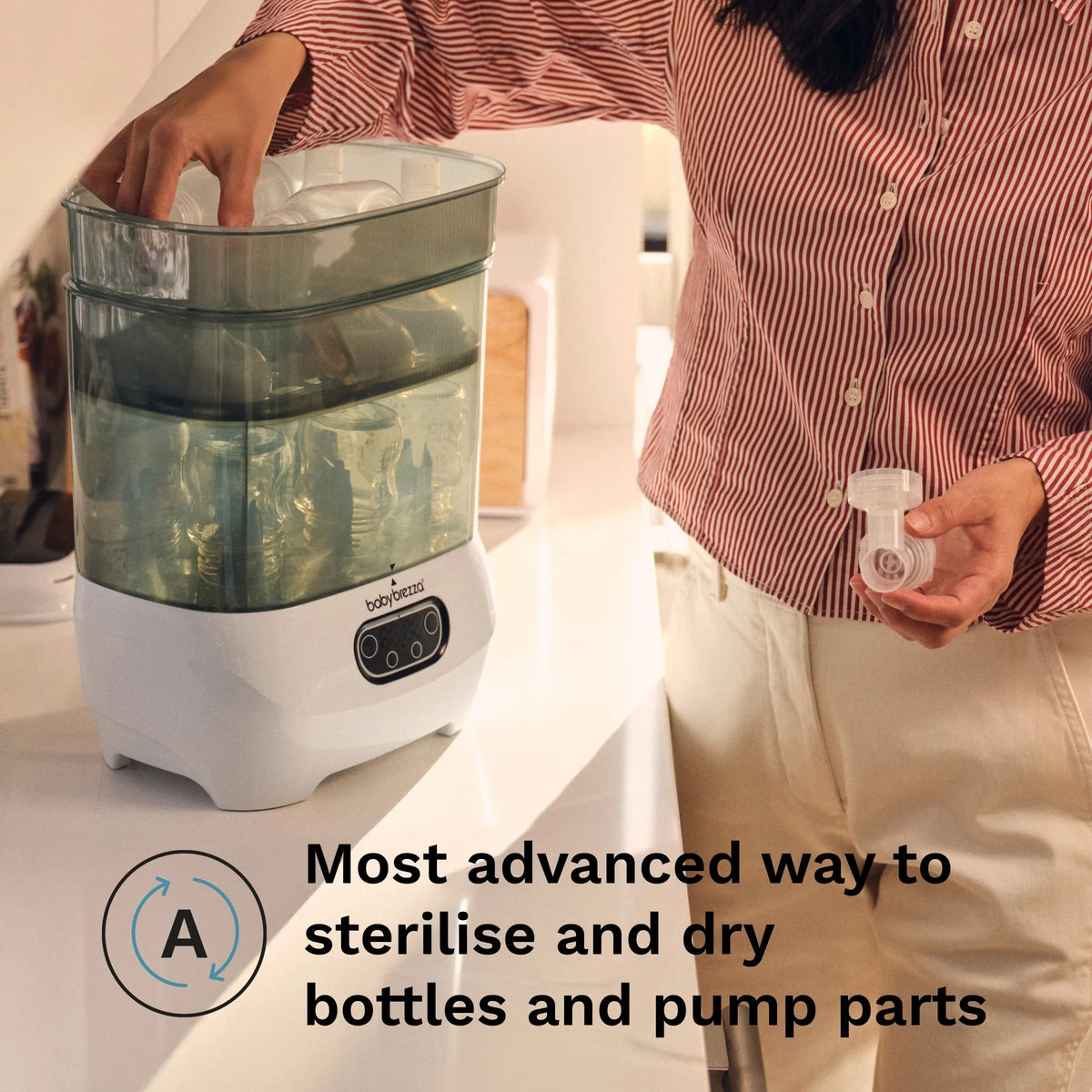 Baby sterilizer dryer unit with hand loading bottles and pump parts into chamber
