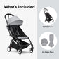 Black-framed stroller with light gray canopy, plus 6+ color pack accessories.
