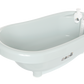 Thermobath Sepp bathtub, side view with built-in faucet and knobs, light blue