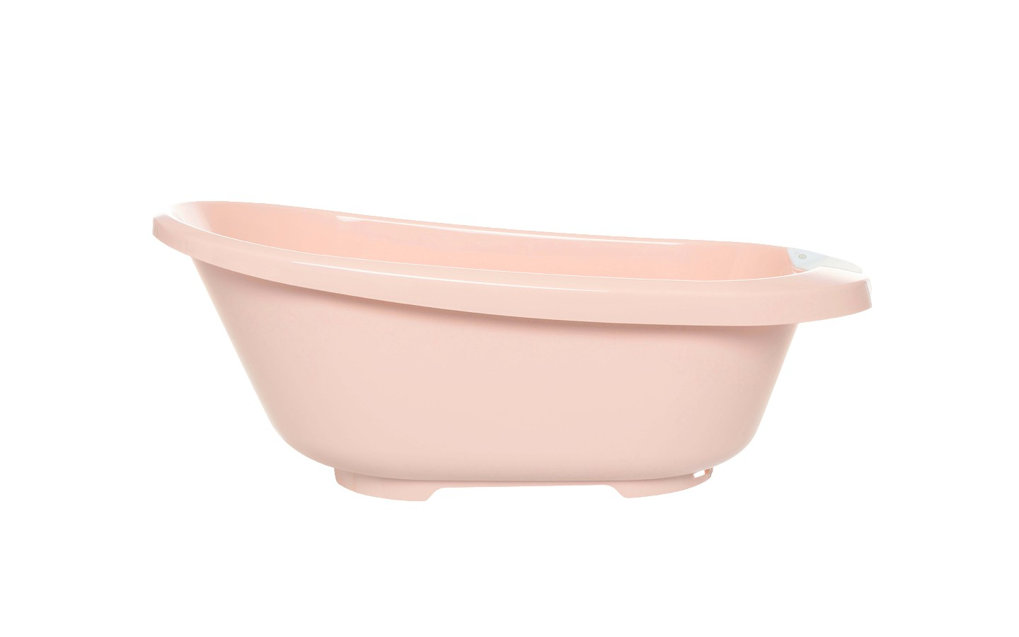 Pale pink plastic bath tub, angled side view with wide rim