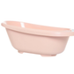 Pale pink plastic bath tub with curved sides and wide rim