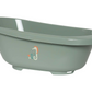 Light green bathtub with seahorse decal, side profile and wide oval rim