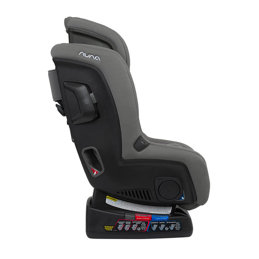 Gray Nuna convertible car seat with padded headrest and harness, rear-facing