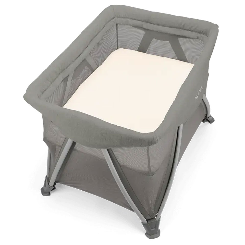 Grey zippered bassinet with padded mattress and mesh sides on folding stand