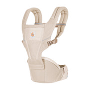 Beige baby hip seat carrier with front pocket and adjustable shoulder straps