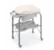 Bath changer with padded white top, gray frame, white tub, and side rails