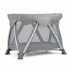 Nuna air bassinet with gray canopy and zippered mesh sides, on folding stand