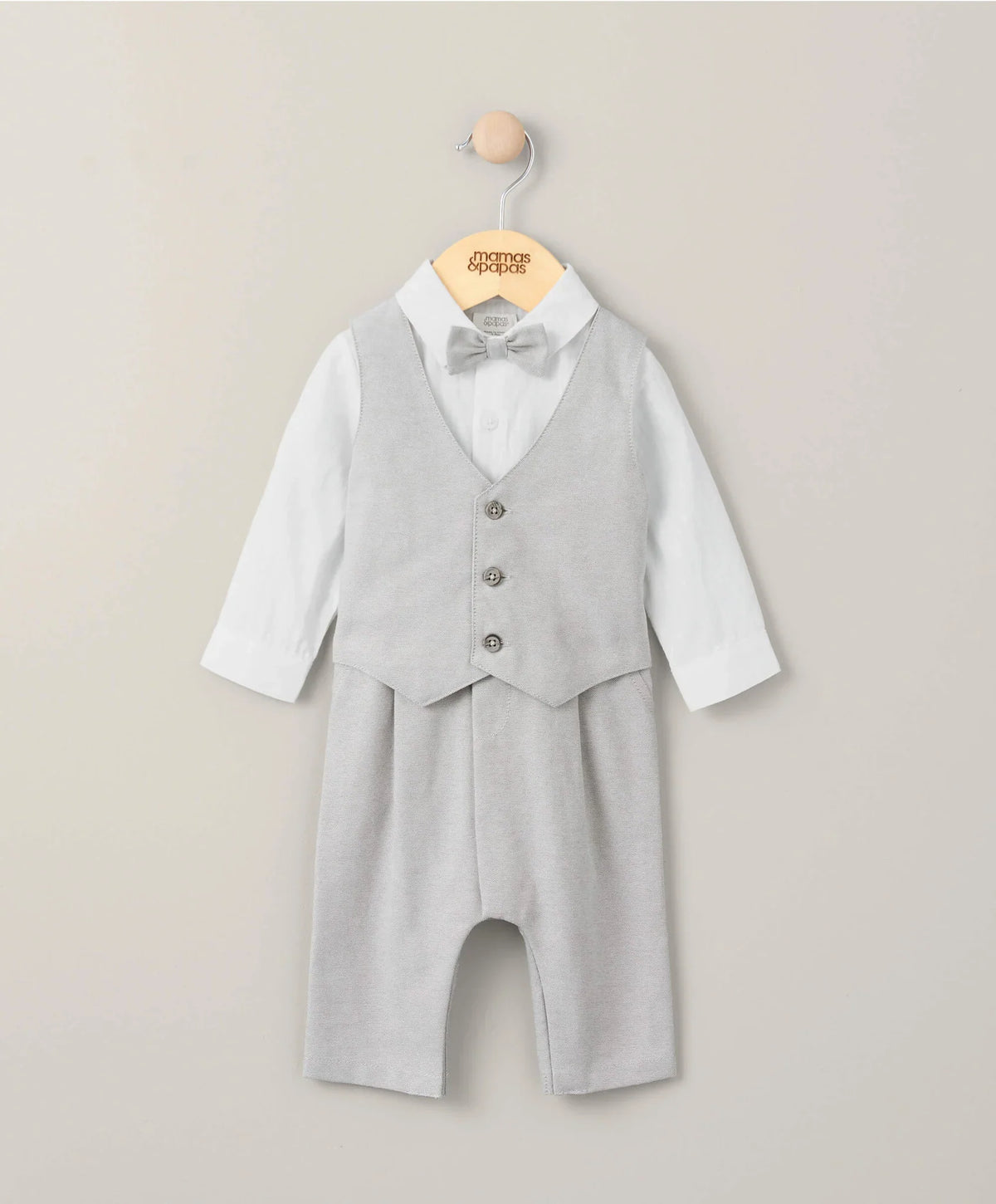 Cream linen mock romper with gray waistcoat, bow tie, and front buttons