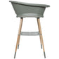 Light green baby bathtub on wooden legs with front support shelf