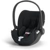 Black infant car seat with padded headrest and side shoulder supports, front-facing