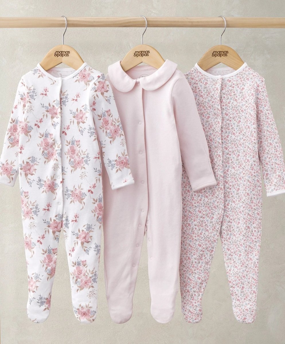 Three footed long-sleeve sleepsuits with snap buttons: floral white, pale pink, pink ditsy