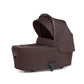 Ocarro 2 carrycot in dark brown with open canopy and padded side support