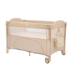 Baby cot with two levels in beige, see-through side panels and caster wheels
