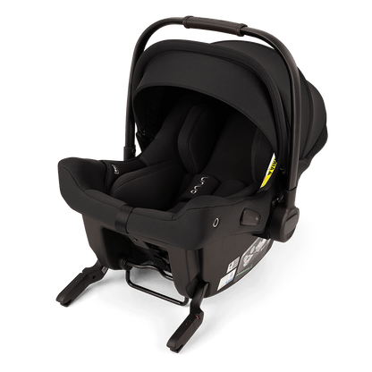 PIPA URBN black infant car seat with carry handle and canopy, angled view