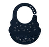 Silicone baby bib in dark navy with paper-plane print and snap-adjustable strap